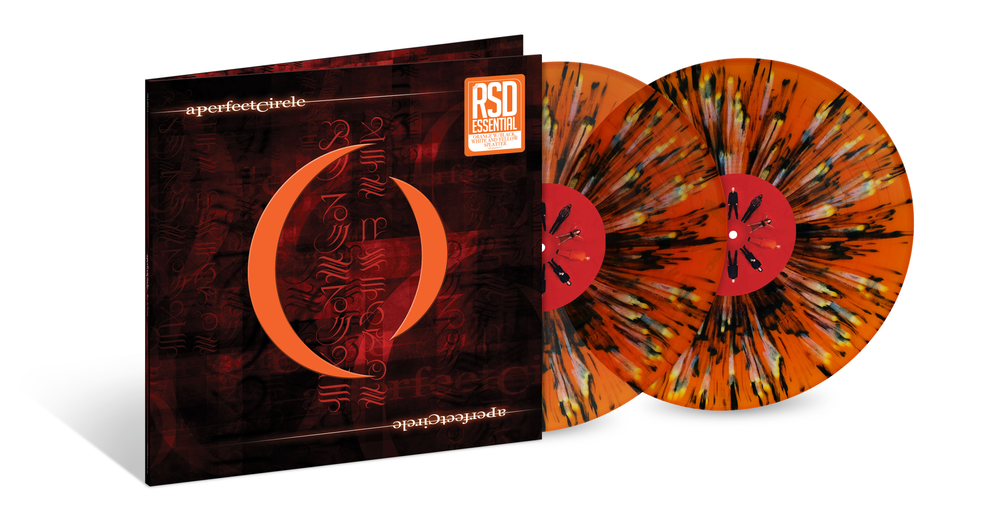 the album cover for A Perfect Circle - Mer De Noms [RSD Essentials Orange w/Black White & Yellow Splatter]